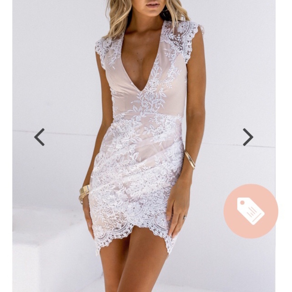 Pretty nude dress with white lace overlay.